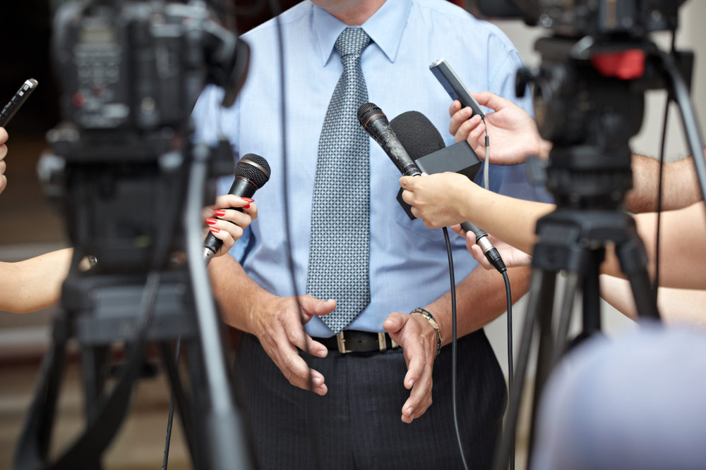 close up of conference meeting microphones and businessman close up of conference meeting microphones and businessman